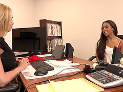 Two hot chicks are having fun in the office with each other