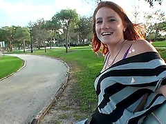 Redhead Lindsey fondles her tits and rides big dick