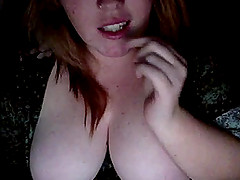 Slutty dark-haired chick sucks her fingers in front of a webcam