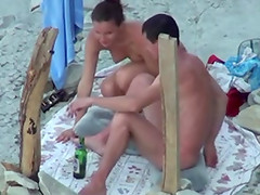 Pretty brunette sucks her man's dick on a beach in hardcore clip