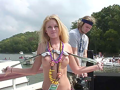 Blistering hot cowgirl in sexy bikini flashes her natural tits in wild yacht party