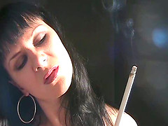Hot woman has her hot style of smoking