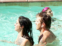Two girls and a guy have some hardcore fun in the pool