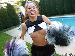 A cute cheerleader flashes her tits while in her uniform