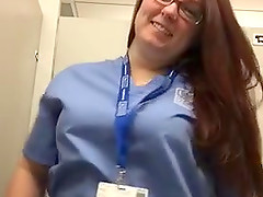 Nurse showing her pierced nipples