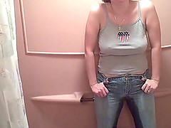 Busty MILF pissing in her pants