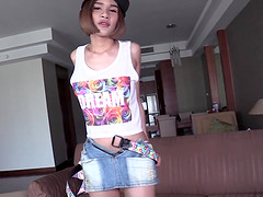 Young Thai t-girl Benty takes off her denim miniskirt