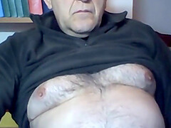 62 years old man from Italy demonstrates his hairy torso