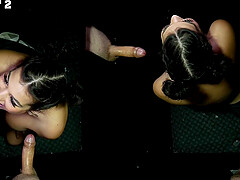 Petite brunette Lilith Grace gives a blowjob through the gloryhole.