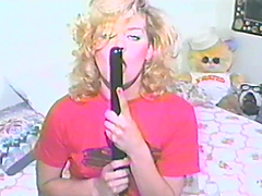 Curly blonde chick toys her shaved pussy in retro video