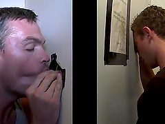Busty gay with studs giving his gentleman blowjob through gloryhole