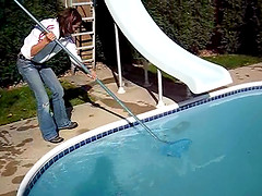 Cute black-haired babe rescuing a frog out of the pool