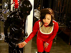 Lady Ashley in red costume plays sex games with her kinky friend